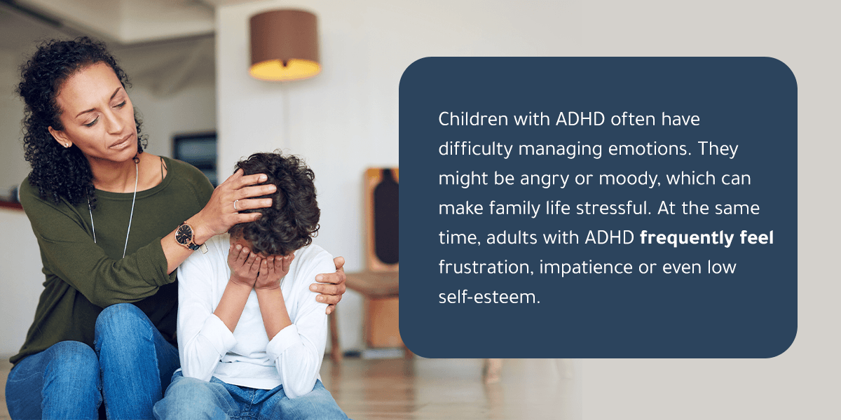 Adult comforting a stressed child. Children with ADHD often have difficulty managing emotions. 